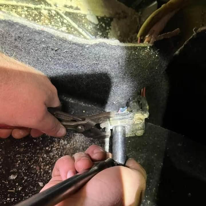 Working on a wiring connection inside a vehicle