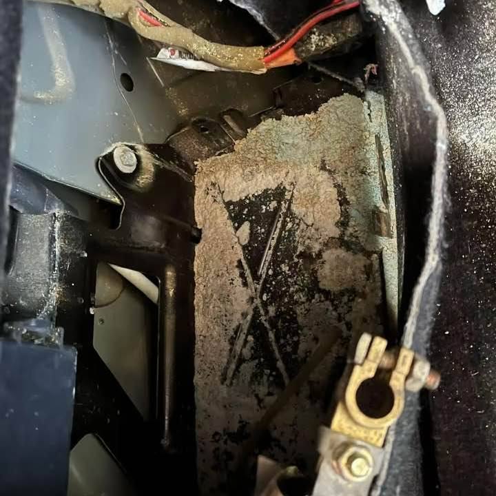 A battery terminal and clamp being checked